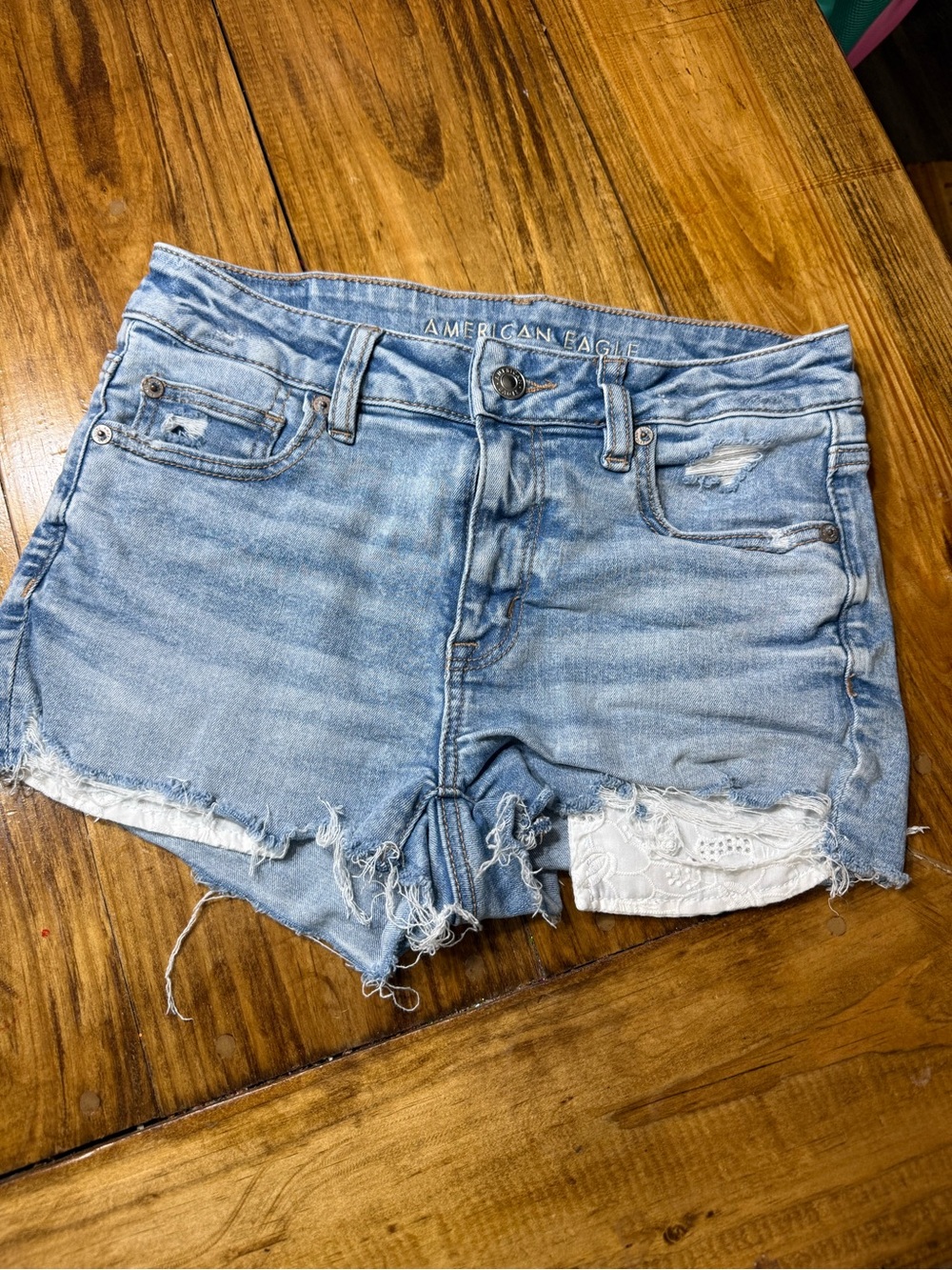 American Eagle Outfitters Light Wash Distressed Denim Shorts with Lace Trim